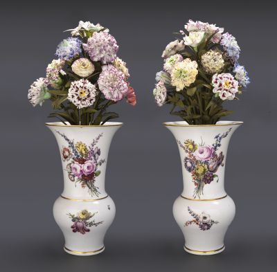 Pair of vases with porcelain flowers