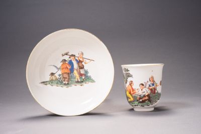 Nymphenburg beaker with saucer, painted with polychrome peasant scenes in a rural setting in the style of Joseph Kaltner